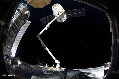 SpaceX's Cargo Dragon 17th resupply mission to the ISS on the Canadarm2.