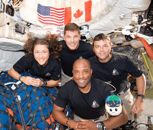 Artemis II crew with their zero gravity indicator